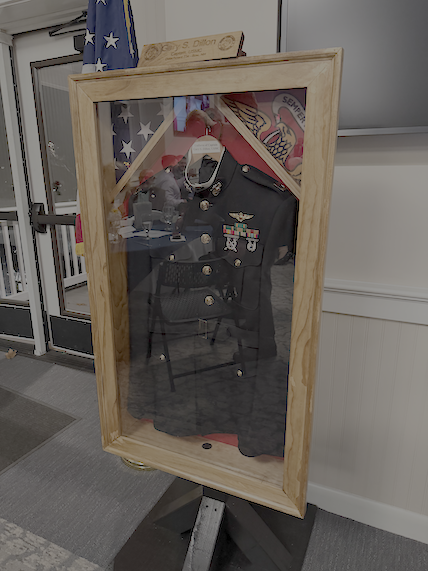 The Dillon Detachment displays the uniform of Capt Dillon next to the Missing Man Table, to honor him and all MIA and POW’s. 